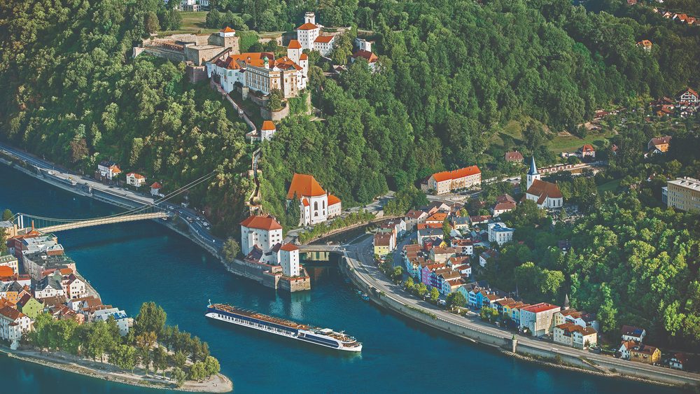 River ship on the Danube at Passau, Germany, below the Veste Oberhaus fortress
